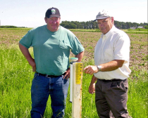 Gary Zoubek, UNL Extension shows a producer how to install and use an ET gage.